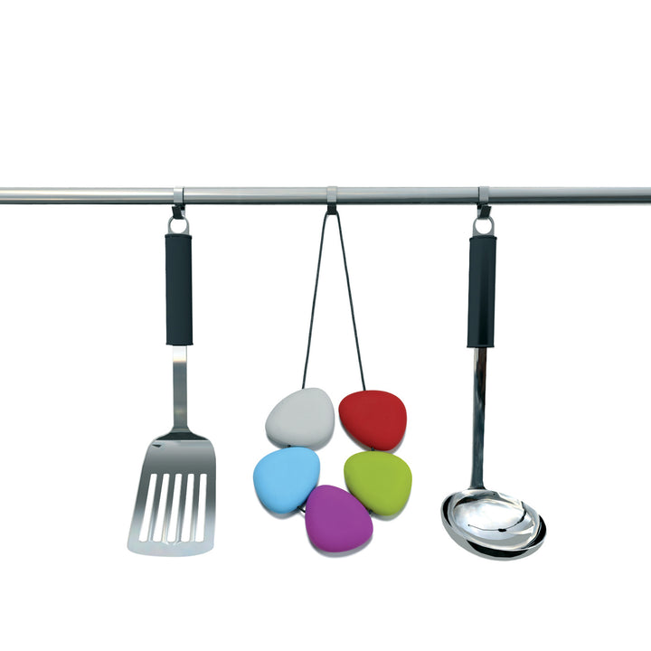 Lib Editeurs D'idees HOT Trivet made in France from Silicone Pebbles and Leather Rope Shown Hanging Among Kitchen Utensils