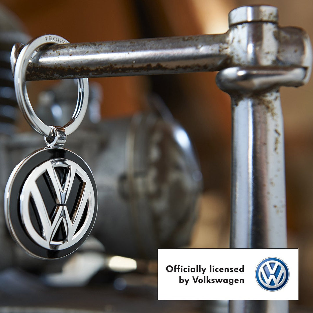 Troika Officially Licensed Volkswagen VW Pendant Key-ring in Black Enamel and Chrome shown in workshop