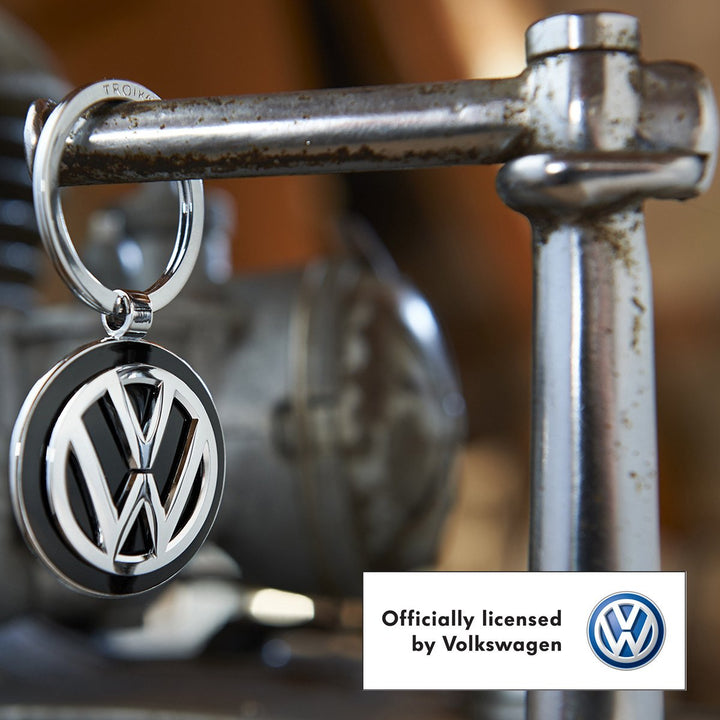 Troika Officially Licensed Volkswagen VW Pendant Key-ring in Black Enamel and Chrome shown in workshop