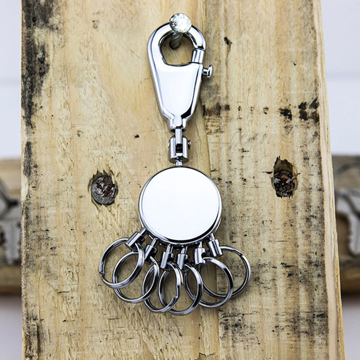 Troika Multi-Ring Patent Keyring in Shiny Chrome Item KYR60/CH Showing On Wood Background